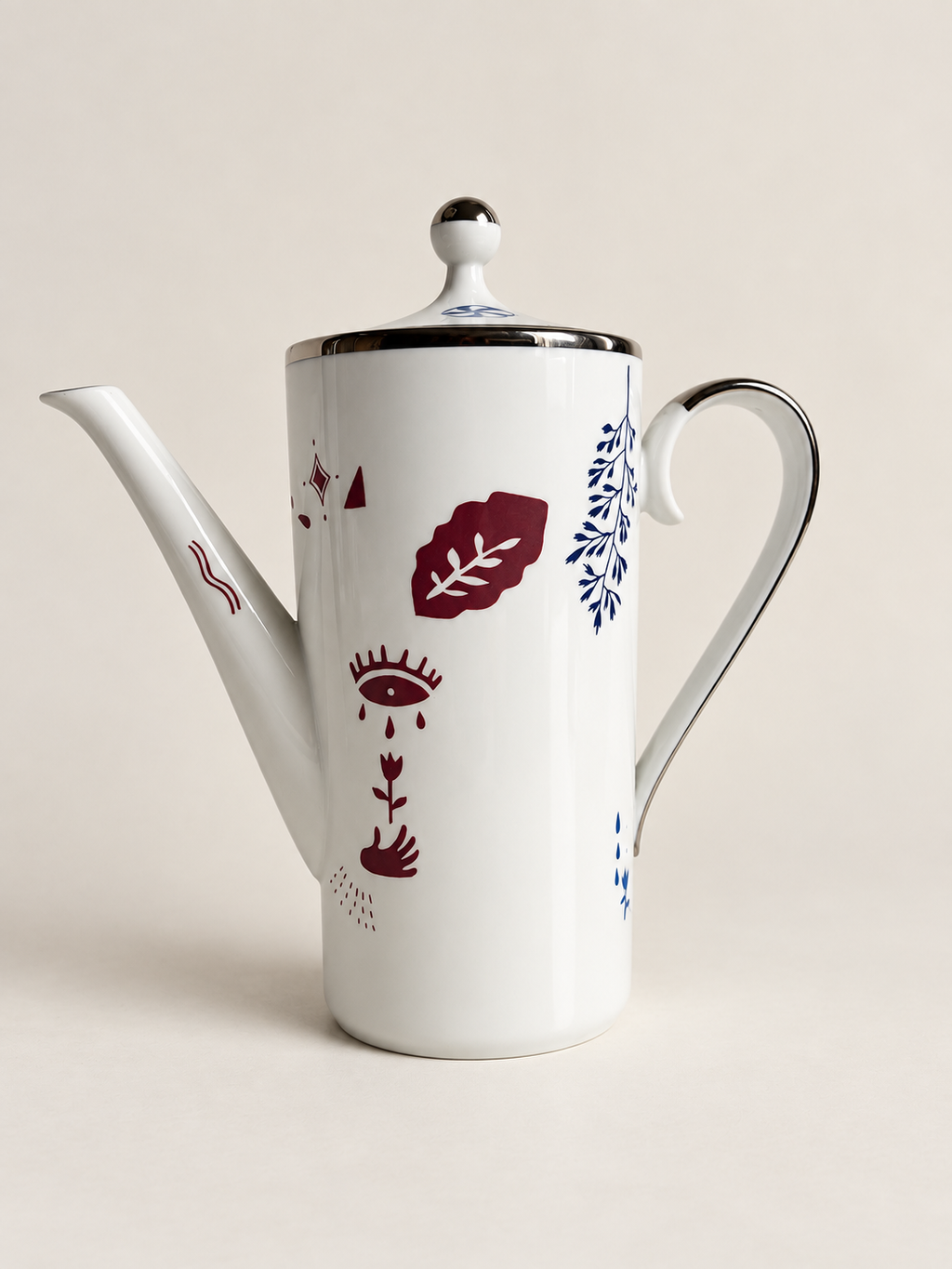 Kaffekanna framsida – öga, hand och blomstermotiv