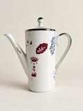 Kaffekanna framsida – öga, hand och blomstermotiv
