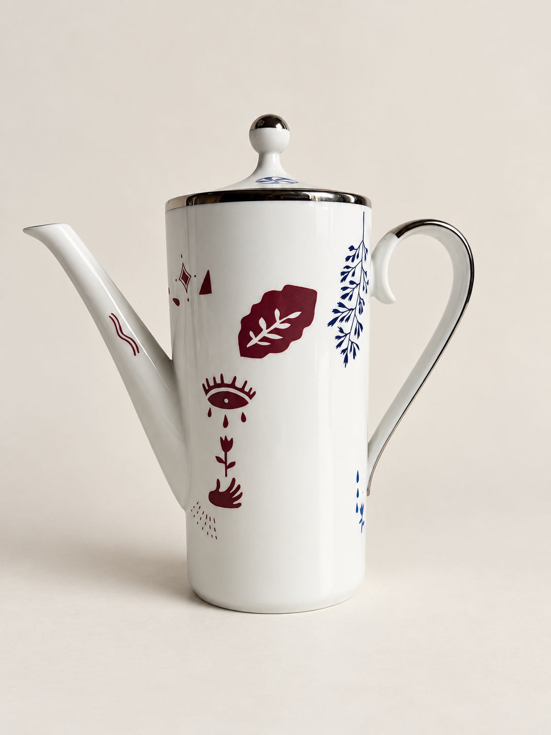Kaffekanna framsida – öga, hand och blomstermotiv